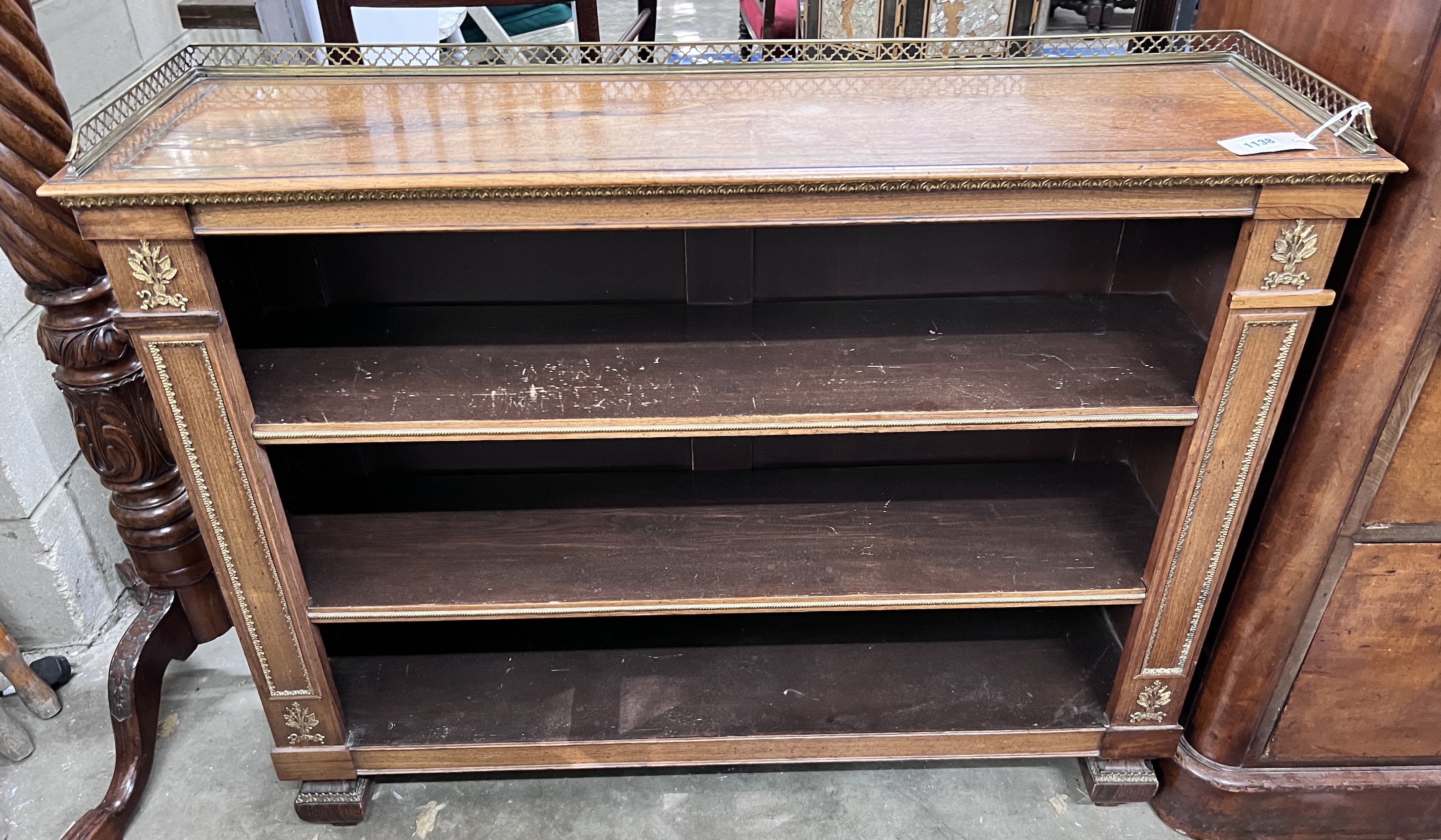 A Regency style giltwood metal mounted rosewood open bookcase, width 111cm, depth 30cm, height 90cm